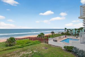 Direct oceanfront 22 corner condo with large balcony, heated pool, and garage parking