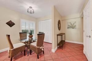 Direct oceanfront corner 22 with stunning views, huge balcony, heated pool, and garage parking