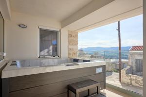 Myrtia Cave Maisonette with hot tub by Chic Greek Villas
