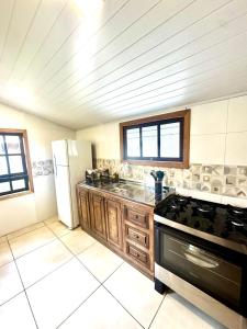 Casa aconchegante na Ferrugem - 2 quartos - 450m da Praia