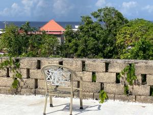 Suite Retreat with rooftop deck offering panoramic sea view