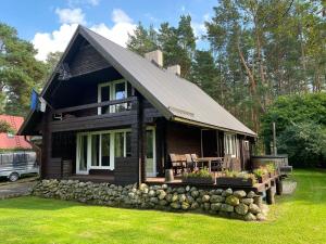 Cozy loghouse with sauna near a great sandy beach