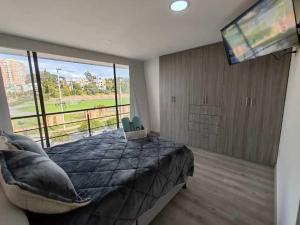 Apartamento moderno frente a la Universidad Santo Tomás WiFi y parqueadero