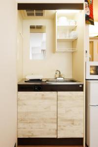 206 Great access to the city center 4minute walk from ShinOkubo Station 15minute walk from Shinjuku Station 2 double beds maximum 4 guests