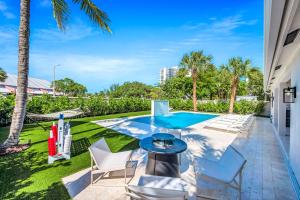 Steps from Beach Heated Pool Sunrise Key RESlDENCES