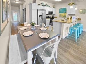 Have a beachy time at this 5 star townhome!