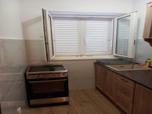 Apartments Kalajzic - Two Bedroom Apartment with Garden and Terrace A2 ST