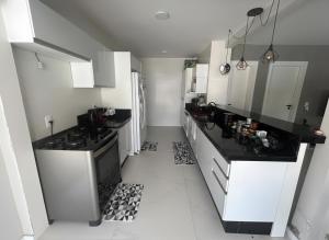 Casa com piscina, churrasqueira e toda climatizada