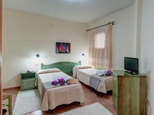 Triple Room with Balcony room in I Ginepri Hotel