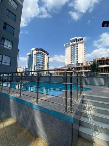 newly furnished two bedroom apartment with swimming pool, fully equipped gym, private parking space ,children playground and unbeatable scenic city views