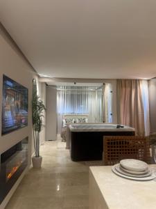 AquaEros - Appart Jacuzzi Carré Eden Marrakech