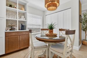 Renovated direct oceanfront corner 22 with a large balcony, heated pool, and garage