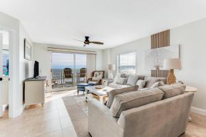 Renovated direct oceanfront corner 22 with a large balcony, heated pool, and garage