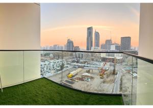 Chic Modern Studio Unit in JVC with 65 inch TV