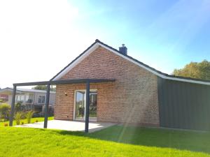 Haus KüstenBrise - Urlaub mit Hund an der Küste mit eigenen Garten, Sauna und gemütlichen Kaminfeuer