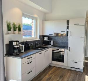 Haus KüstenBrise - Urlaub mit Hund an der Küste mit eigenen Garten, Sauna und gemütlichen Kaminfeuer