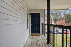 Spacious living room with fireplace and balcony