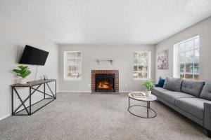 Spacious living room with fireplace and balcony