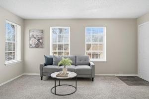 Spacious living room with fireplace and balcony