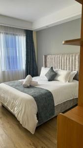 luxurious two bedroom apartment with well equipped gym,heated swimming pool, ample parking space and a relaxing rooftop with amazing city views