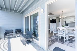 Summerhouse West 102A by Youngs Suncoast