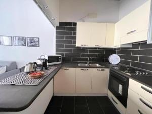 House with Dream Panoramic Terrace in the Heart of Bosa, 80 sqm with BBQ and Breathtaking View