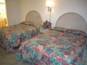 Room with Two Queen Beds and Side Ocean View and Kitchenette room in Apollo Motel