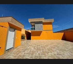 Casa com piscina privativa, churrasqueira e 2 suítes - Condomínio Costa Rica - Itanhaém - lado praia