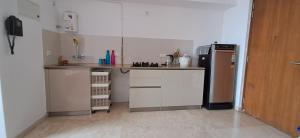 Happy Homes Hospitality - Cozy Homestay Studio Apartment at Hiranandani Estate Thane with stunning Lake Facing Skyscraper view