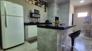 Casa com Piscina e Churrasqueira