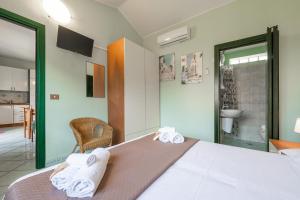 Villetta Acquamarina 3 camere, giardino privato con barbecue, a 450 mt dalla spiaggia Le Saline