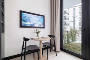 Stylish Apartment with Underground Parking Located Near the TAURON Arena by Noclegi Renters