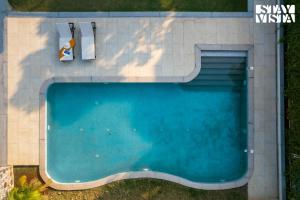 StayVista at Terra Palms with Pool, BBQ