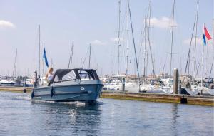 Beach Front Ship In Ouddorp With House Sea View