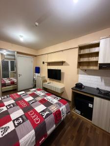 Green Pramuka City apartment by SM ROOM