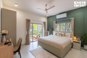 StayVista at La Beaumont with Pool & Lawn