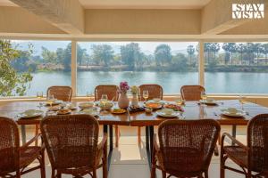 StayVista at Maison Vera with Pool, River front view