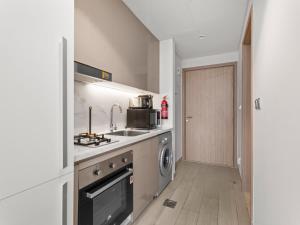 The Comfort Cove Studio in Azizi Riviera 32