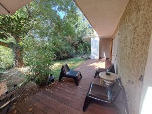 Cottage with terrace in lush greenery