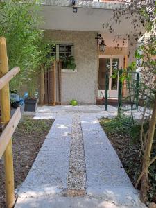 Cottage with terrace in lush greenery
