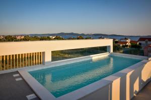Apartments with heated rooftop pool, Bibinje