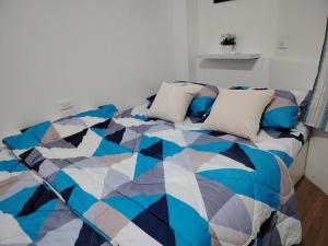 Apartment with a bedroom, living room, kitchen, and a balcony