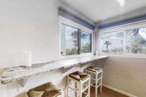 Renovated condo with ocean views, pool, & beach access