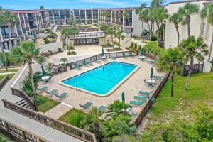 Modern oceanview condo with multiple balconies, pool & WD - beach access