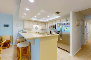 Oceanfront condo with pool, ocean views, and washerdryer