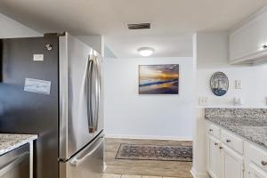 Oceanfront condo with private balcony, shared pool and beach access