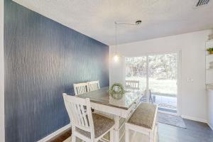 Dog-friendly home with fenced yard, patio, grill, & park across the street