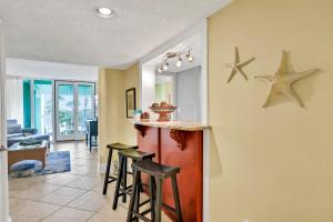 Oceanfront condo with direct beach access, pool, balcony, grilling area, & AC