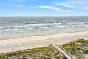 Oceanfront condo with pool, grill, central AC, washerdryer, & snowbird friendly