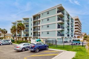 Modern oceanfront condo with outdoor pool, balcony, & washerdryer